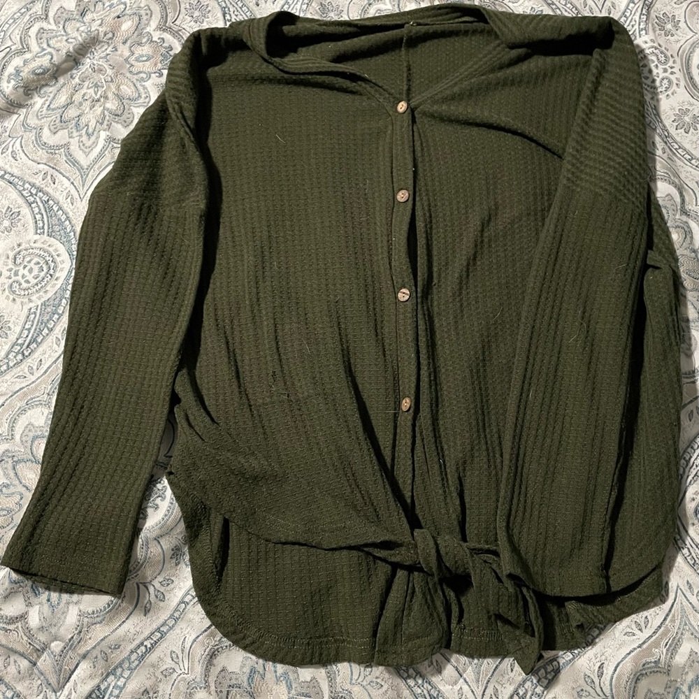 Green button up, tie bottom top.
